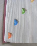 �߂���